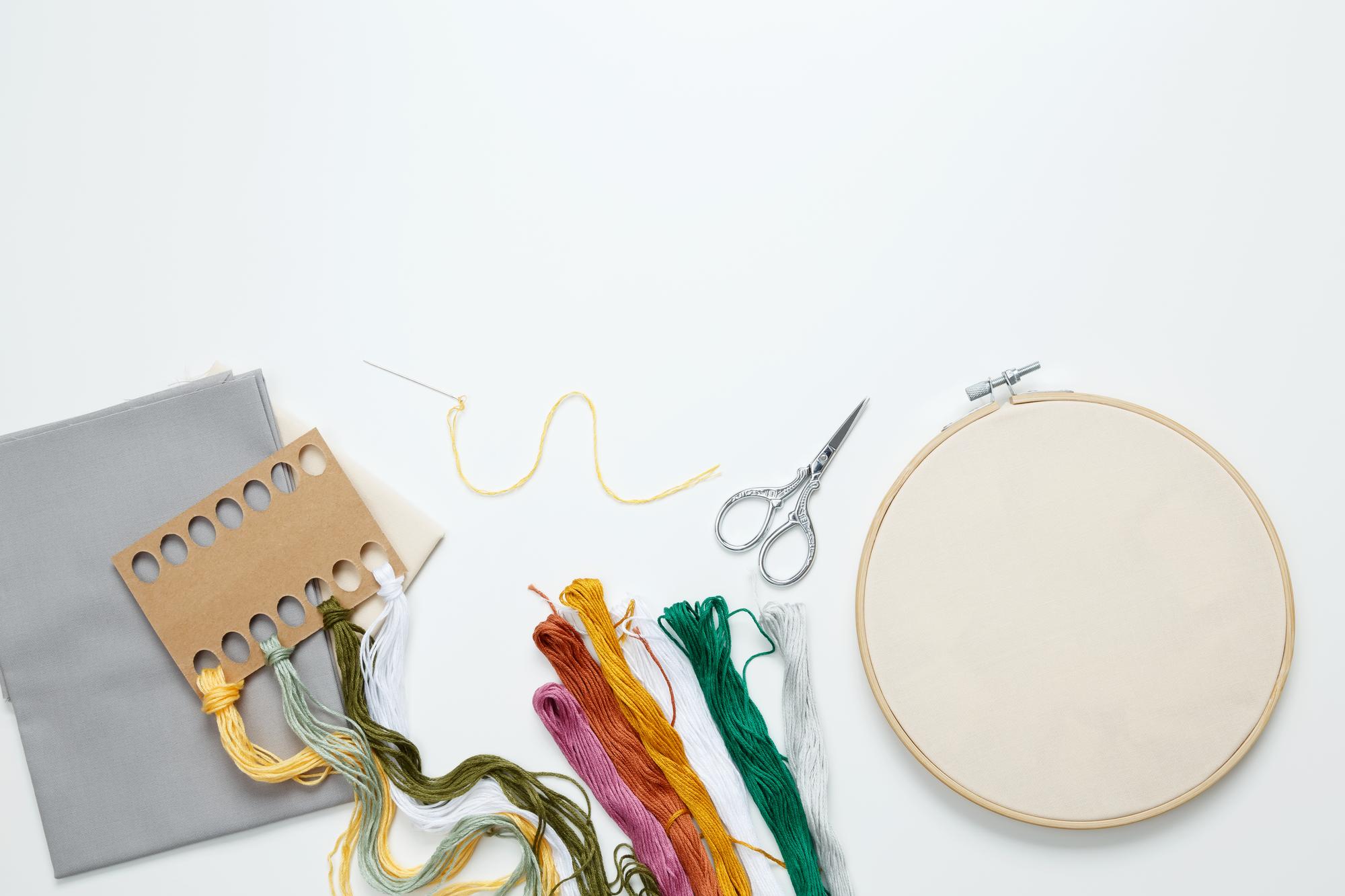 Studio corner with threads and embroidery hoop